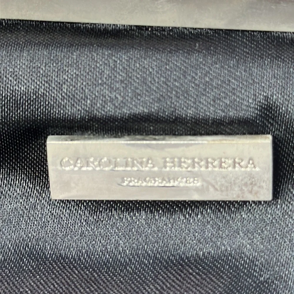 Carolina Herrera kiss lock black and silver clutch